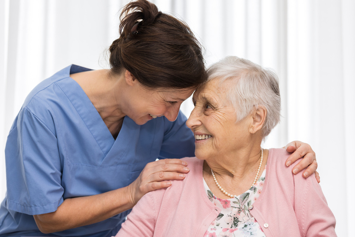 Nurse and elderly female patient